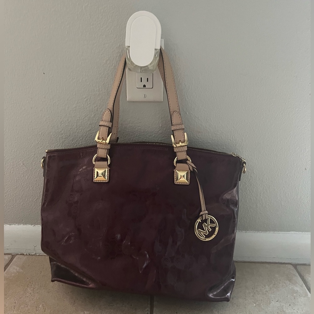 Maroon Michael Kors bag with tan straps